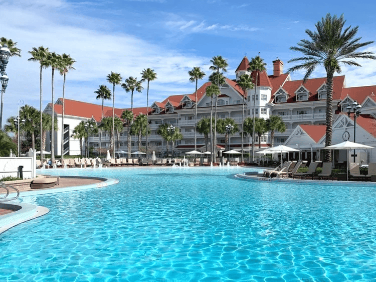 Private car parked curbside at Orlando International Airport with family loading luggage